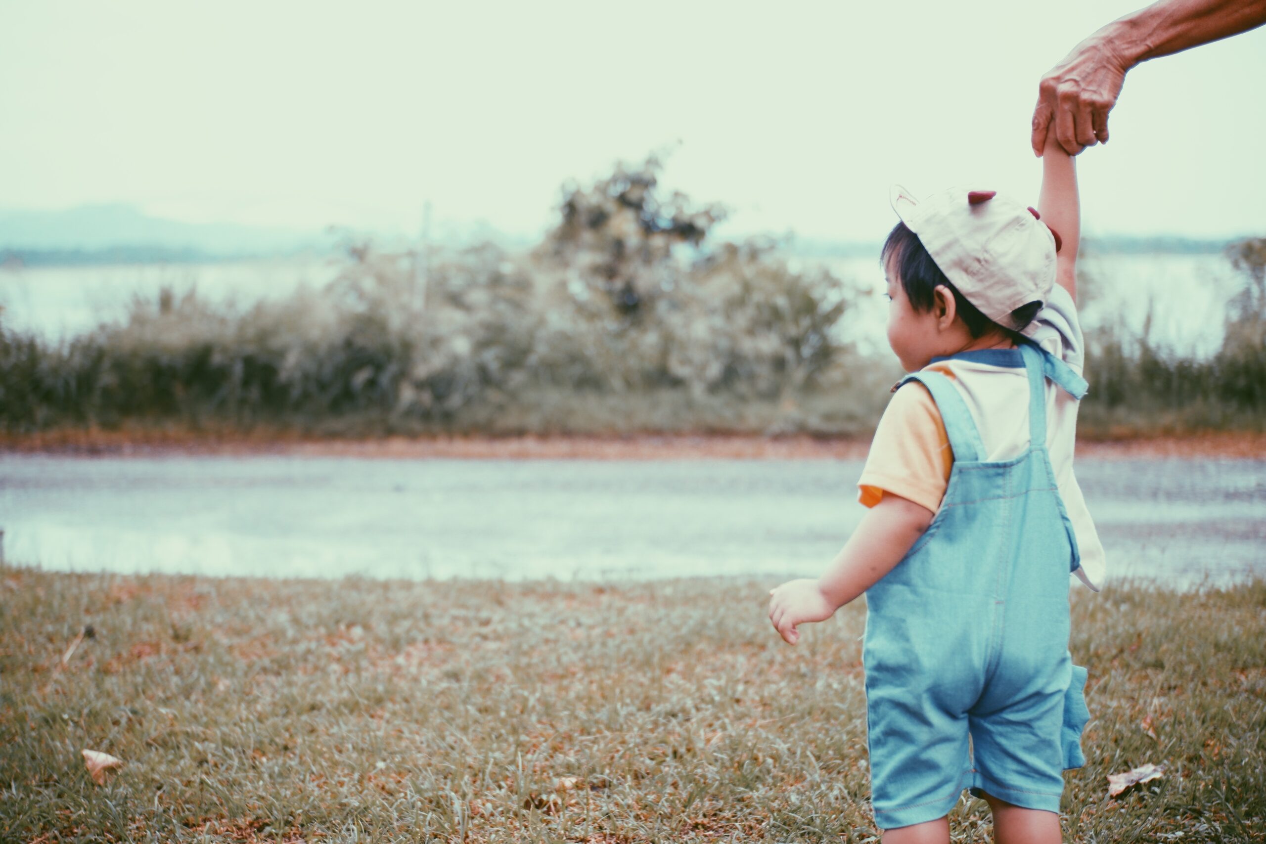 1 year old baby is practicing how to walk