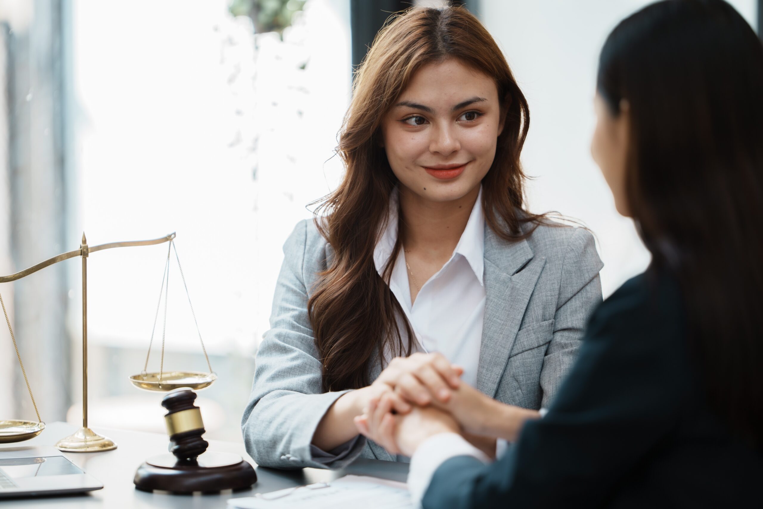Asian female lawyer and business woman customer, Handshake after good deal agreement, Law and Legal
