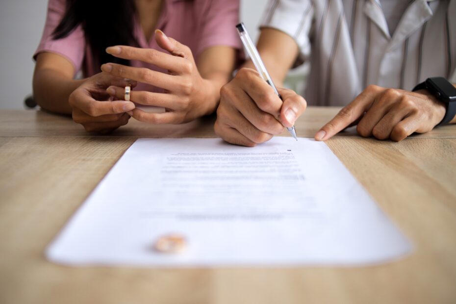 Couple Signing Legal Divorce Documents