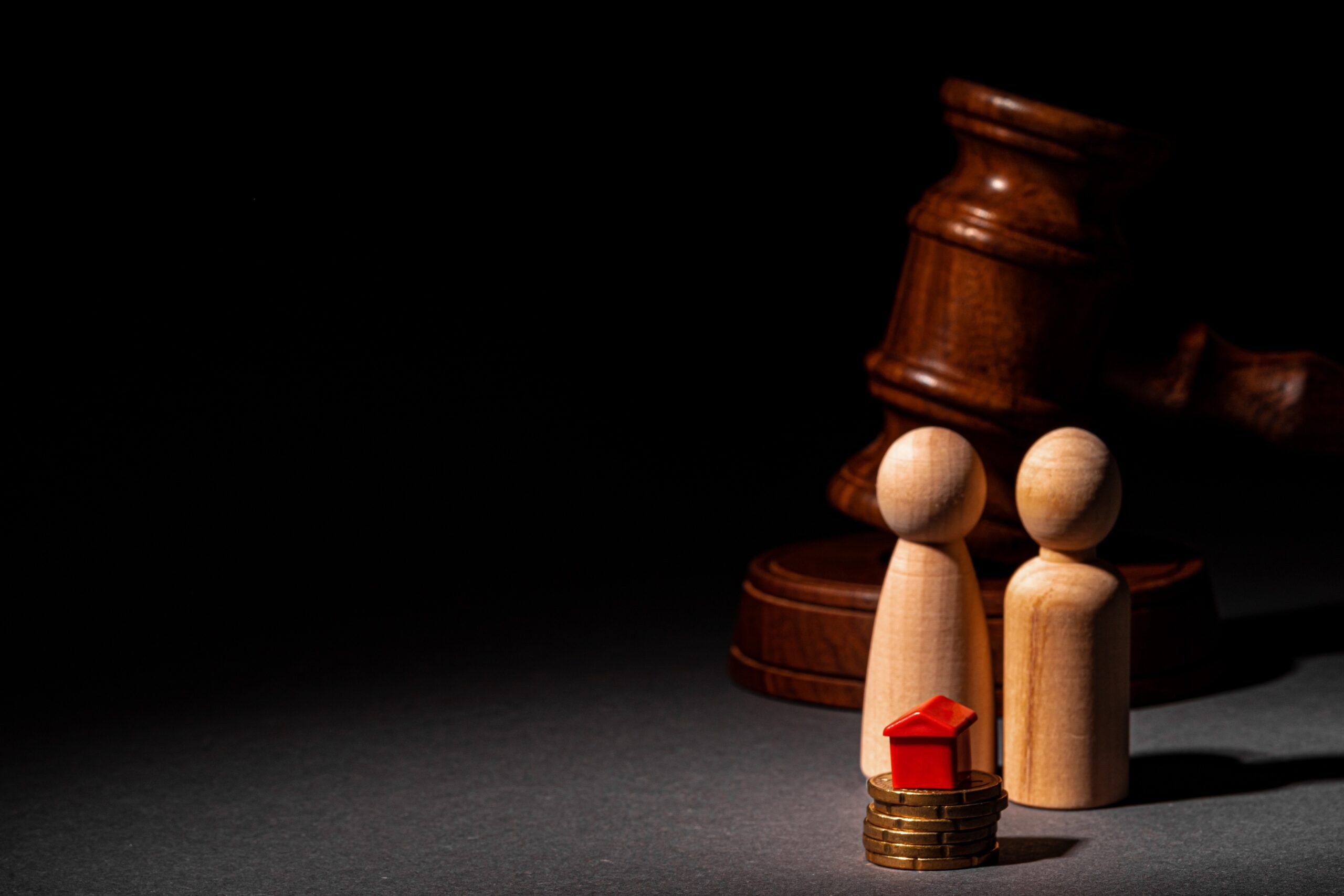 Divorse property division concept. Wooden family with house and judge gavel