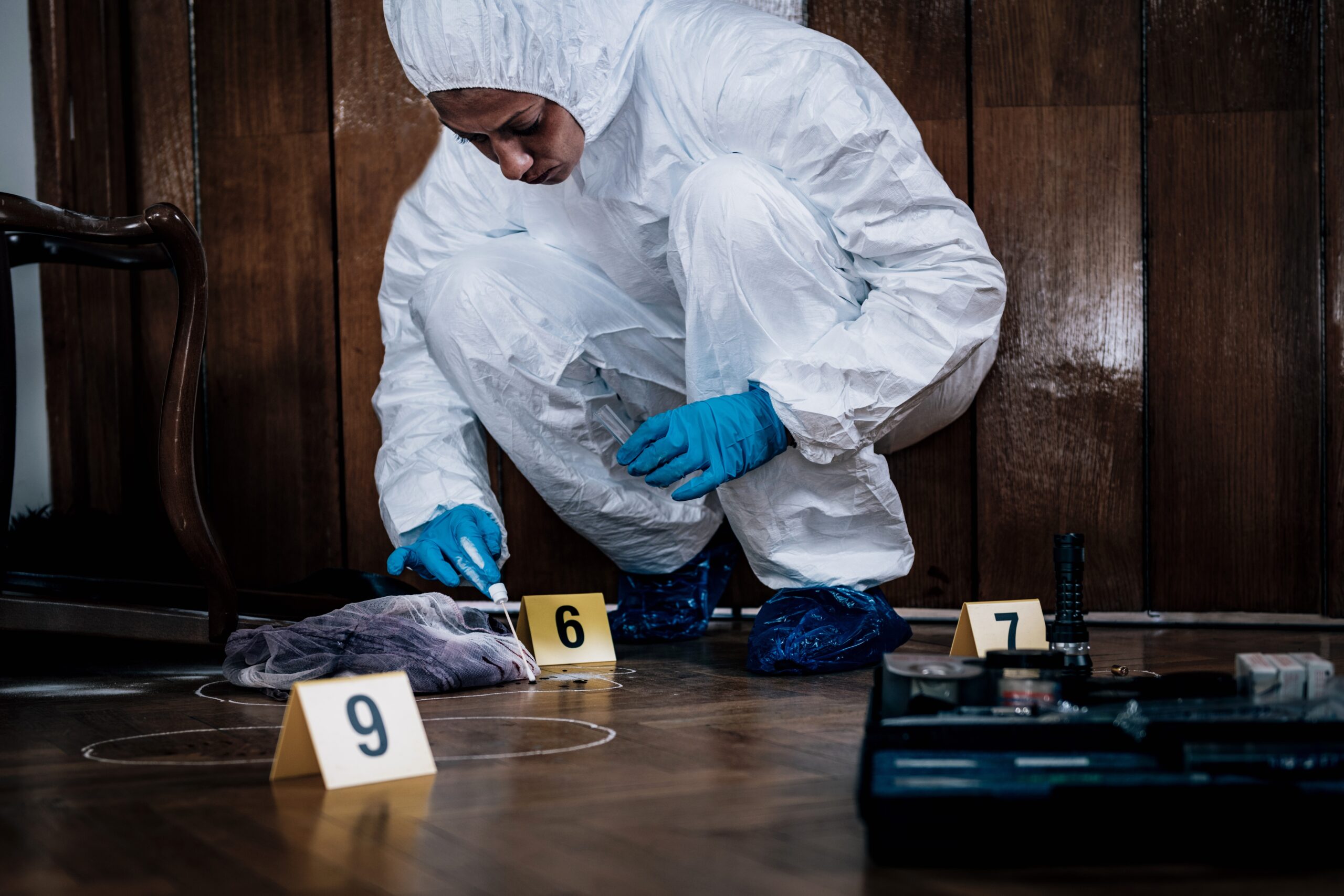Forensic Expert searching for clues