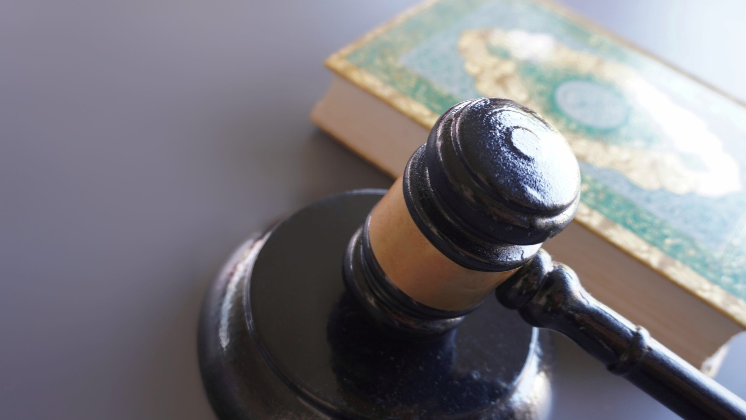 Gavel and Quran with copy space.