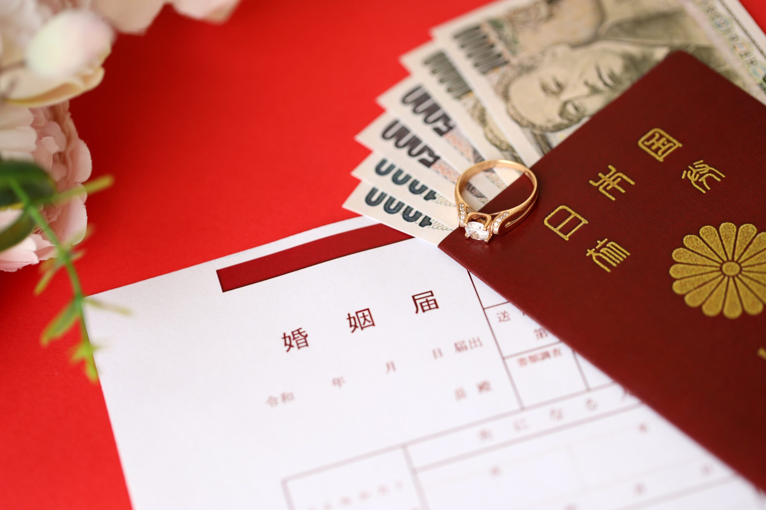 Japanese marriage registration blank document and wedding proposition ring and yen money on table