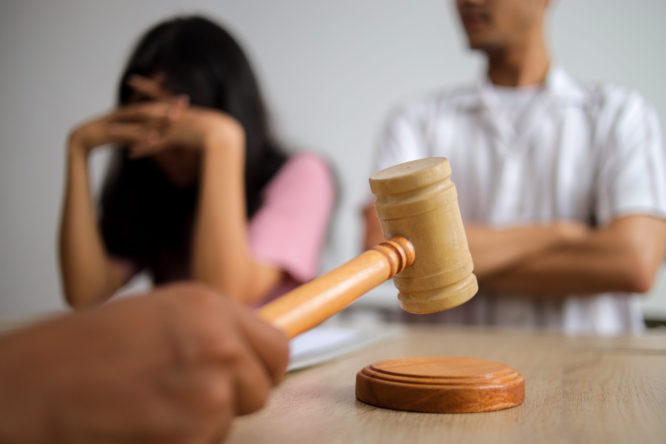 Judge Gavel and Justice Lawyer Deciding on Marriage Divorce Between Married Couple.