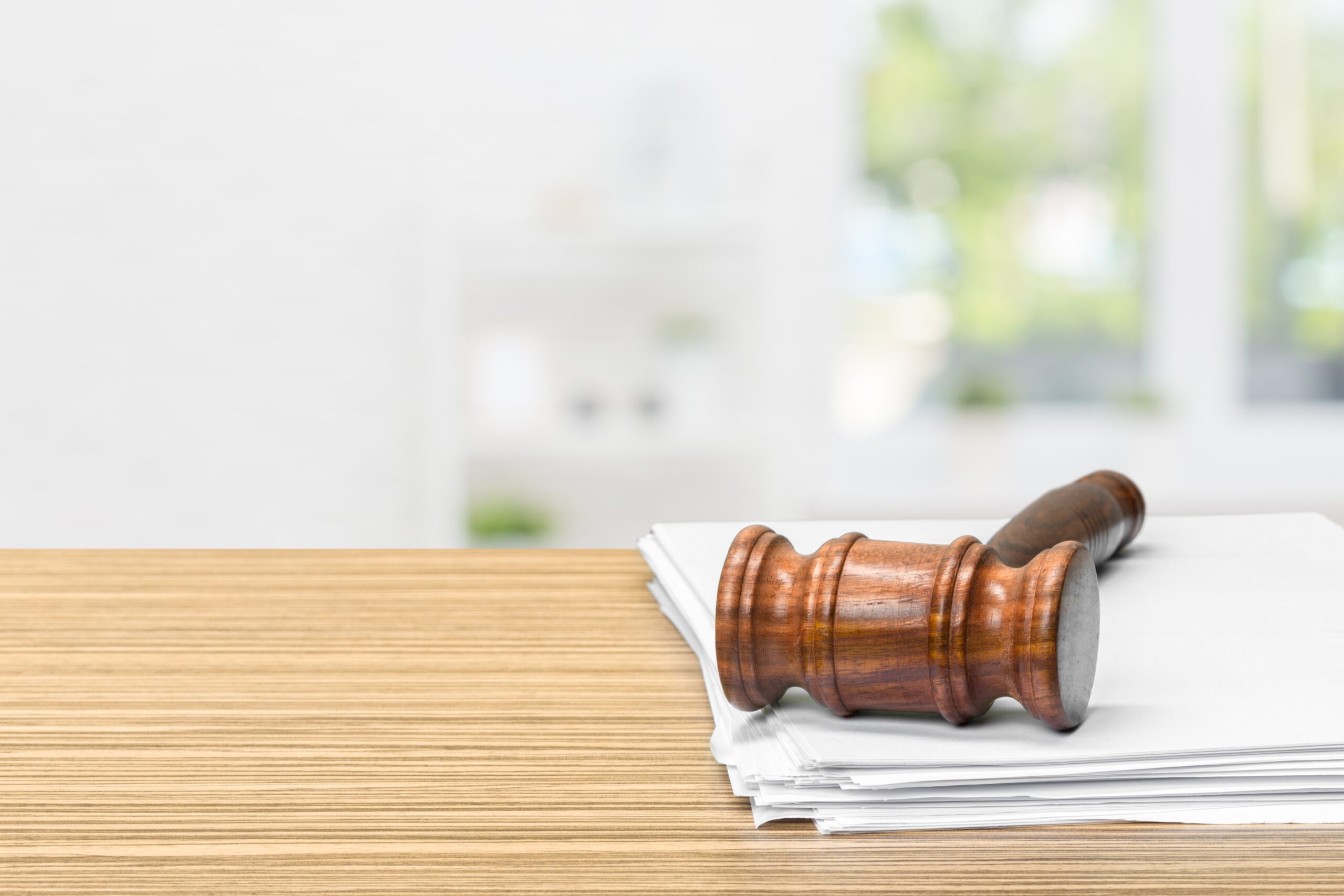 judge hammer on white paper and table