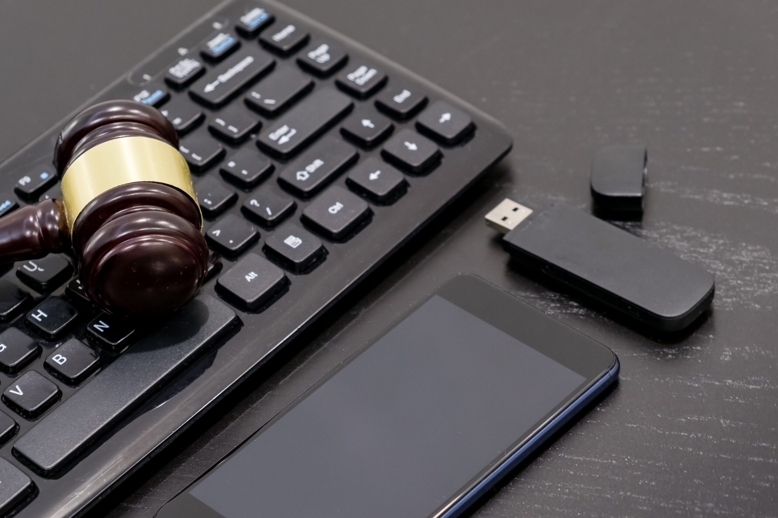 justice and law concept.Lawyer workplace with laptop and documents with dark wooden table