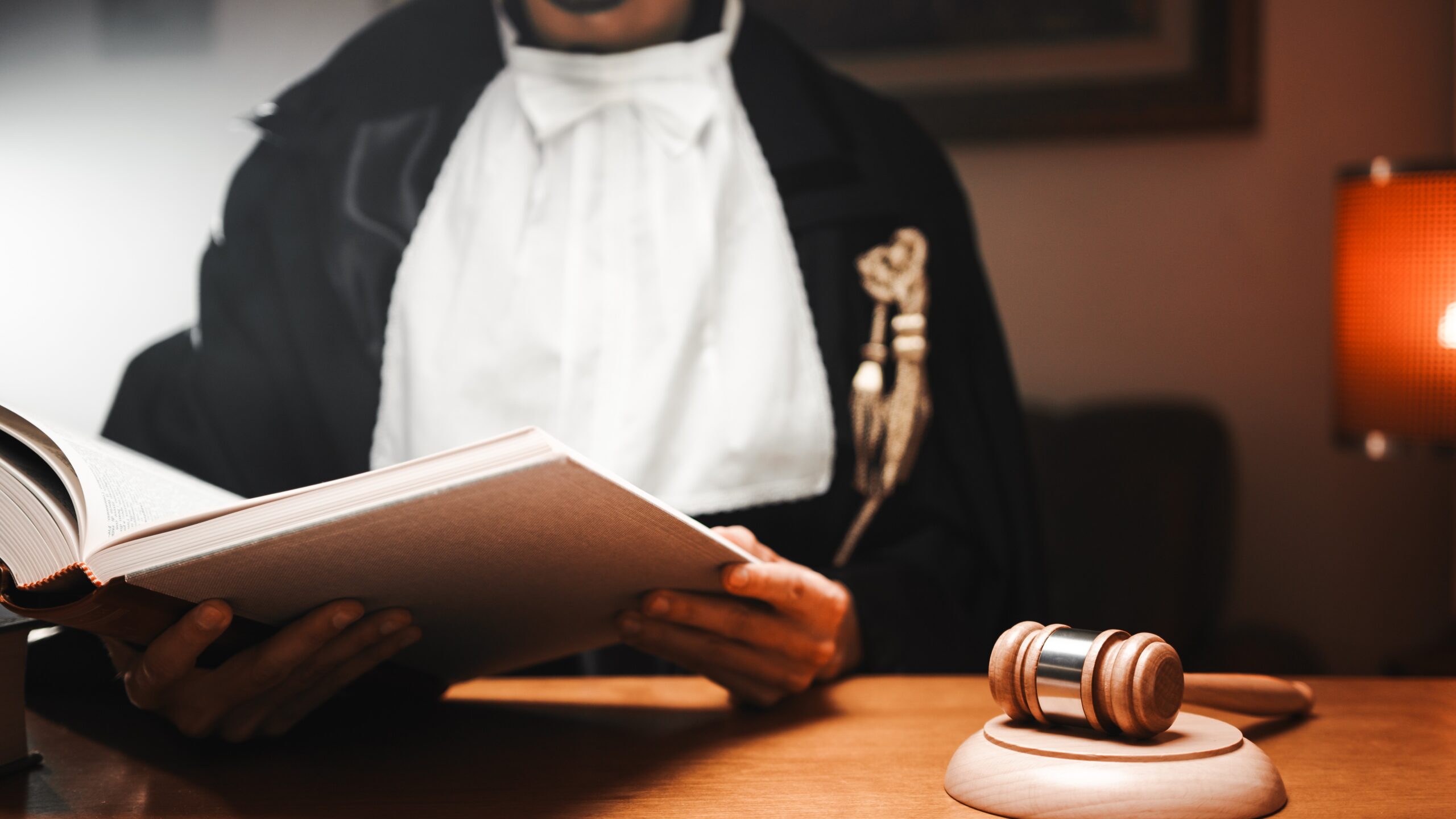 Lawyer In A Courtroom opening a book