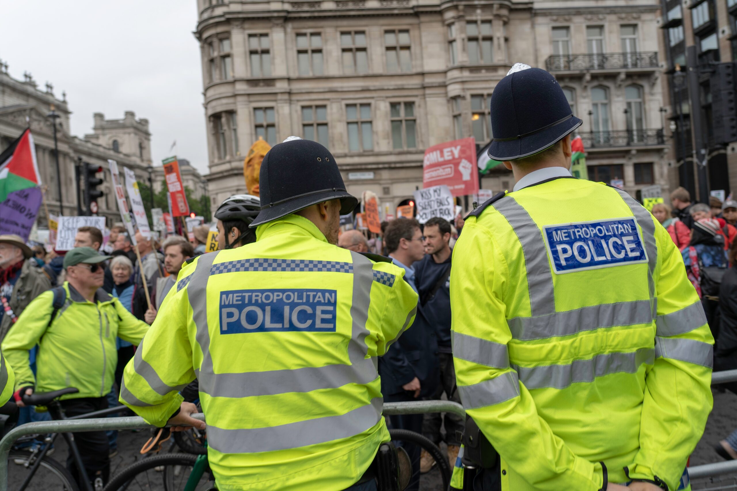 London police at protest, keeping the peace, in high visibility uniform on crowd control