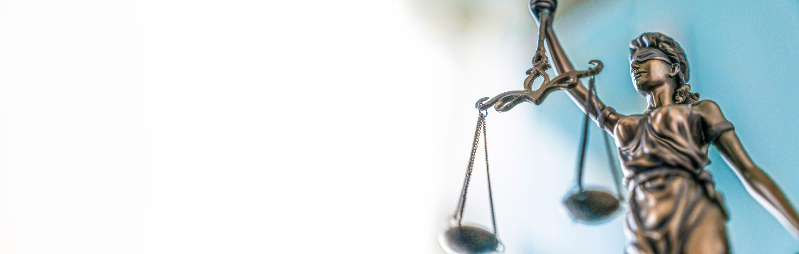 Statue of lady justice on bright background - Side view with cop