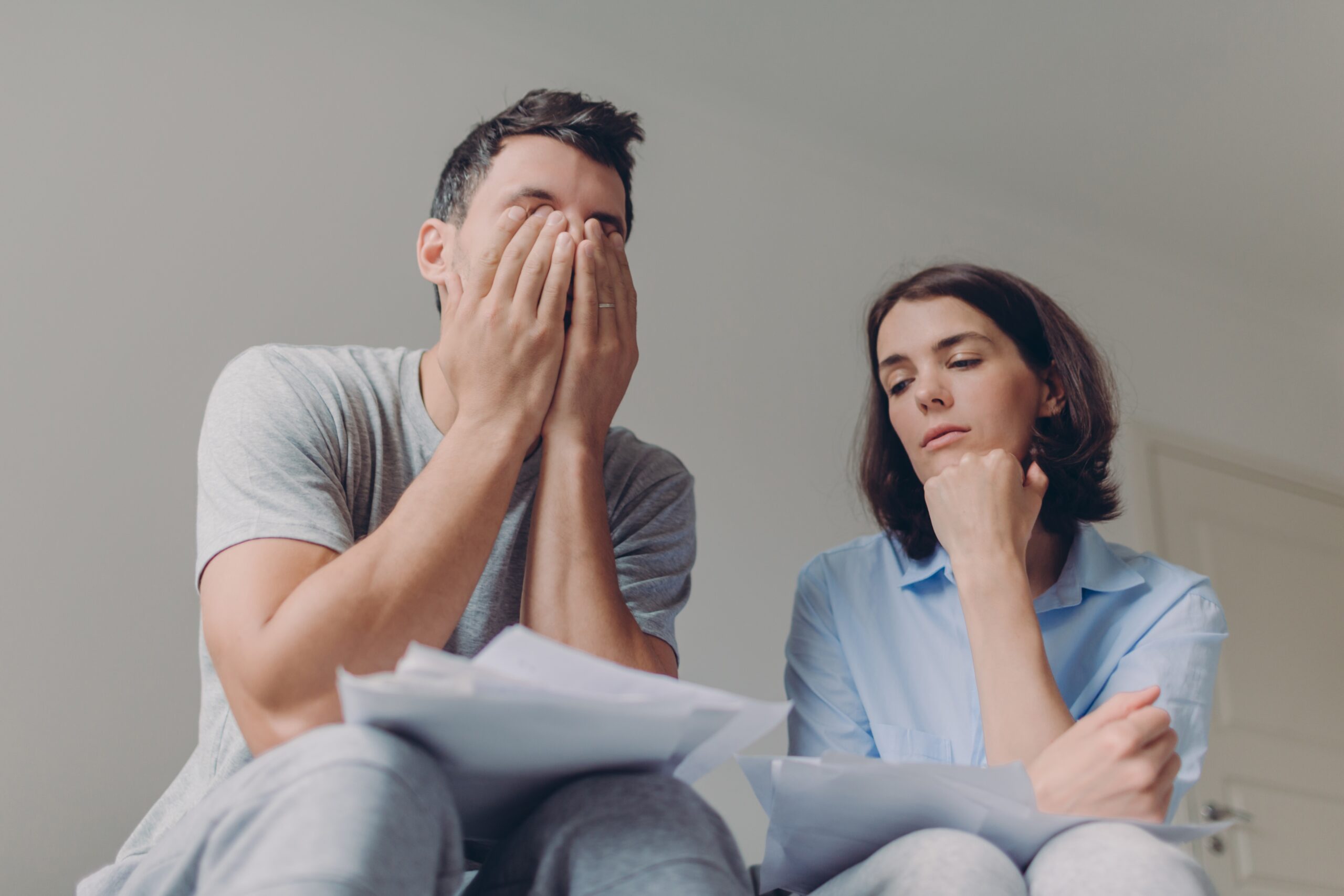 Stressful family couple have debt problems, not able to pay their loan, manage domestic budget