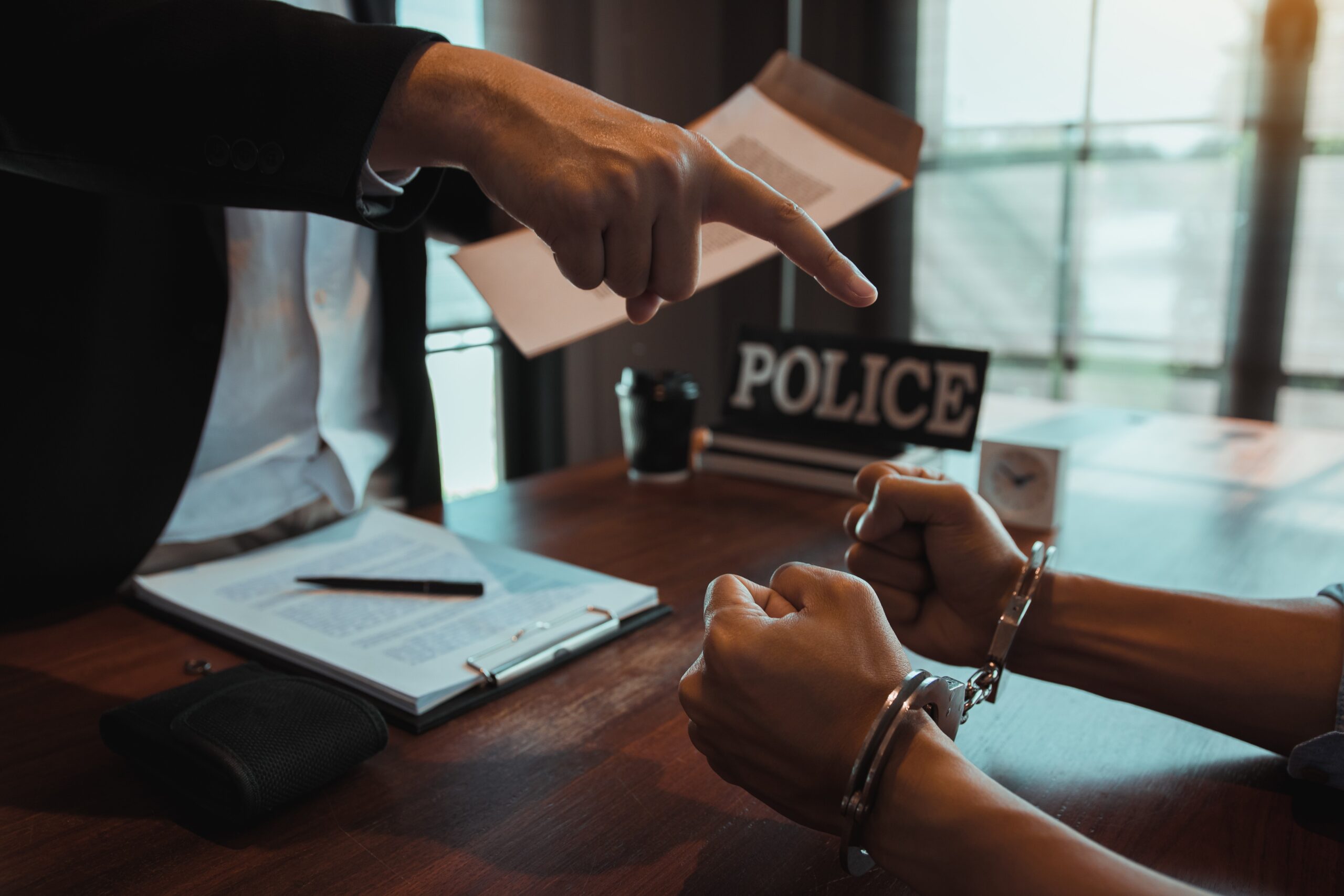 The police officer pointed the handcuffs